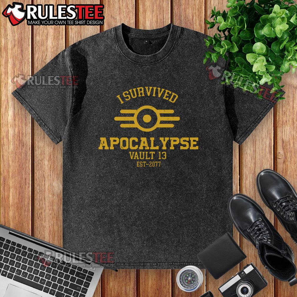 Premium I Survived Apocalypse Vault 13 Est 2077 Washed T Shirt Premium I Survived Apocalypse Vault 13 Est 2077 washed t-shirt featuring a vintage graphic design for gamers.