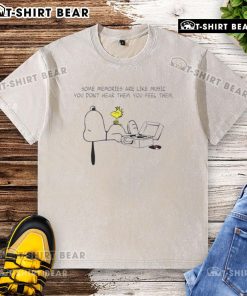 Alt Text: Premium Snoopy washed t-shirt featuring the quote Some memories are like music; you dont hear them, you feel them.