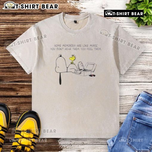 Alt Text: Premium Snoopy washed t-shirt featuring the quote Some memories are like music; you dont hear them, you feel them.