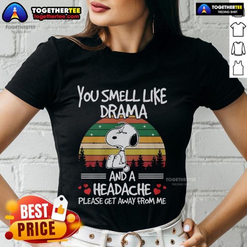 Premium Snoopy tee featuring 'You Smell Like Drama And A Headache' design on a vintage sunset background for ladies.
