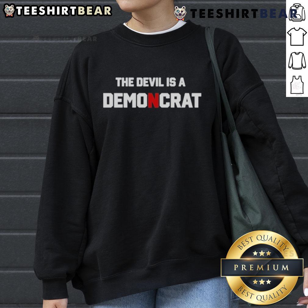 Premium The Devil Is A Demoncrat Sweatshirt Premium The Devil Is A Demoncrat Sweatshirt featuring bold text design, perfect for political humor enthusiasts.