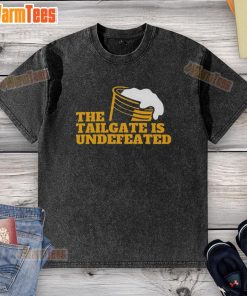 Alt Text: Premium The Tailgate Is Undefeated logo on a stylish washed t-shirt, perfect for game day and casual wear.
