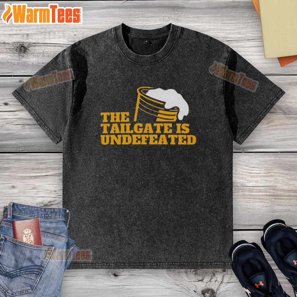 Premium The Tailgate Is Undefeated Logo Washed T Shirt Alt Text: Premium The Tailgate Is Undefeated logo on a stylish washed t-shirt, perfect for game day and casual wear.