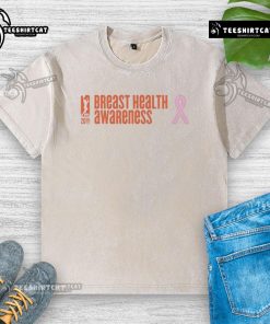 Alt Text: Premium WNBA Breast Health Awareness 20th Anniversary washed t-shirt showcasing vibrant design and supportive message.