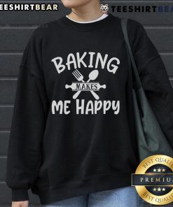 Cozy 'Pretty Baking Makes Me Happy' sweatshirt in a warm kitchen setting, perfect for baking enthusiasts and comfort lovers.