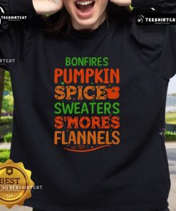 Cozy fall scene with pretty bonfires, pumpkin spice sweaters, and s'mores by flannel-clad friends wearing sweatshirts.
