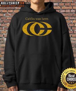 Caitlin Clark wearing a stylish CC logo hoodie, showcasing her unique fashion sense and love for basketball.