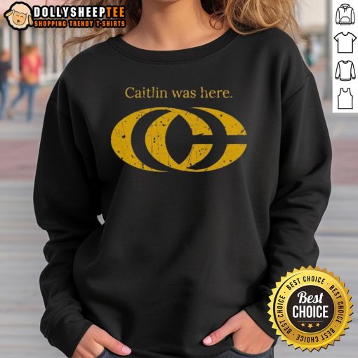 Caitlin Clark wearing a stylish CC logo sweatshirt, showcasing her trendy fashion sense and love for basketball.