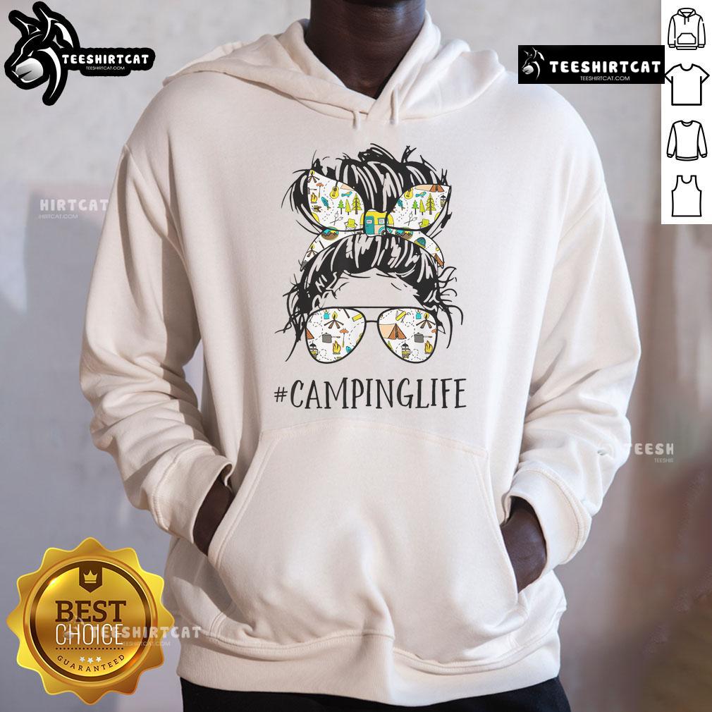 Pretty Camping Life Mom Messy Bun Mom Camping Life Hoodie Mom in a messy bun wearing a cozy hoodie, enjoying the pretty camping life outdoors by a serene lake.