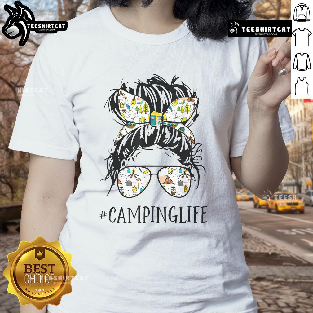 Pretty Camping Life Mom Messy Bun Mom Camping Life Ladies Tee Mom in a messy bun enjoying camping life, wearing a 'Pretty Camping Life' tee, surrounded by nature.