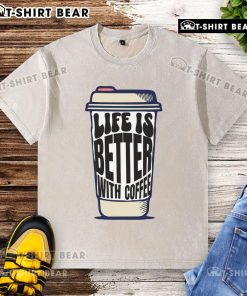 Pretty coffee cup with 'Life Is Better With Coffee' washed t-shirt, perfect for coffee lovers and casual wear enthusiasts.