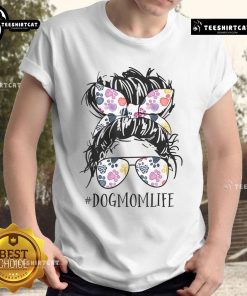 Pretty dog mom wearing a messy bun hairstyle, celebrating Mother's Day in a stylish animal-themed T-shirt.
