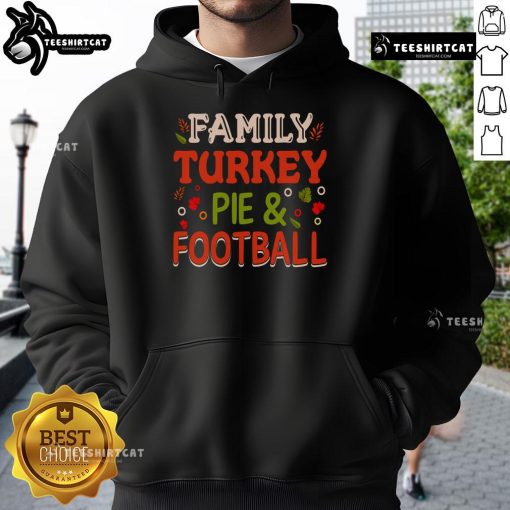 Happy family enjoying turkey pie and football, wearing cozy hoodies for a festive Thanksgiving celebration.