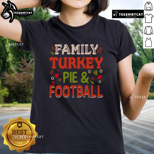 Pretty family enjoying turkey pie while watching football in a cozy living room, showcasing the 'Turkey Pie and Football' tee.