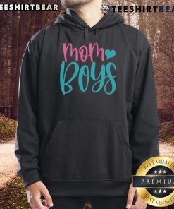 Mom wearing a stylish hoodie with her two boys, showcasing a cozy family moment in a vibrant outdoor setting.