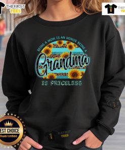 Alt Text: Cozy sweatshirt featuring a sunflower design with the quote Being a mom is an honor, being a grandma is priceless.