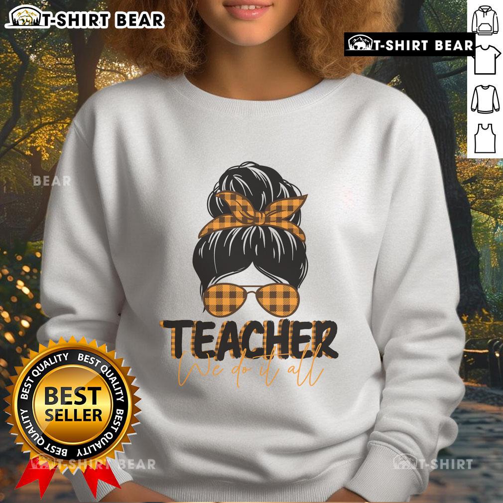 Pretty Teacher We Do It All Messy Bun Sweatshirt Pretty teacher in a messy bun wearing the 'We Do It All' sweatshirt, showcasing stylish and comfortable teaching apparel.