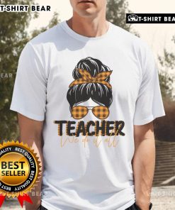 Pretty teacher wearing a 'We Do It All' messy bun t-shirt, showcasing a stylish and casual classroom look.