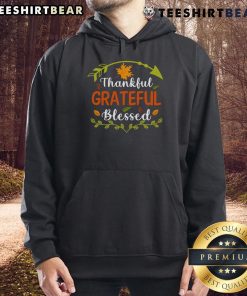 Cozy Thanksgiving hoodie with 'Thankful Grateful Blessed' design, perfect for autumn gatherings and holiday celebrations.