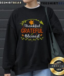 Alt Text: Cozy sweatshirt with Thankful, Grateful, Blessed design, perfect for Thanksgiving celebrations and festive attire.