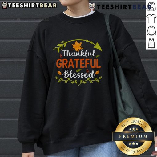 Alt Text: Cozy sweatshirt with Thankful, Grateful, Blessed design, perfect for Thanksgiving celebrations and festive attire.