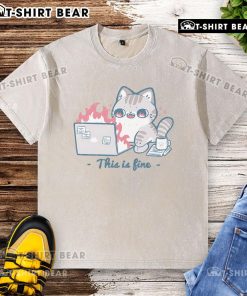 Cute cat wearing a washed T-shirt with 'This is fine' text, showcasing a humorous and relaxed vibe.