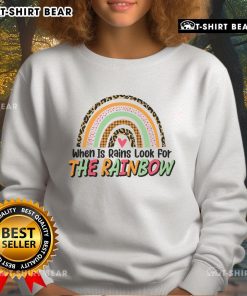 Cozy 'Pretty When It Rains, Look For The Rainbow' sweatshirt displayed on a model, perfect for rainy day fashion.