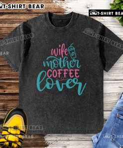 Pretty wife and mother in a coffee lover washed t-shirt, enjoying a cup of coffee at home.