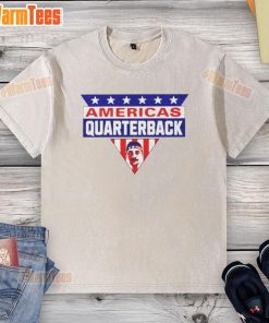 Top Americas Quarterback MVP Buffalo washed t-shirt displayed on a hanger, showcasing a stylish sports apparel design.