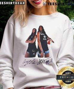 Alt Text: Angel Reese and Kamilla Cardoso wearing Chicago Sky signature sweatshirt, showcasing team spirit and style.