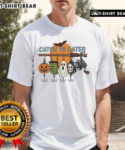 Top Catch Ya Later Halloween Horror Graphic T-Shirt featuring spooky designs and vibrant colors perfect for Halloween festivities.