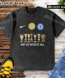 Top Chelsea FC FIFA Club World Cup Champions 'We've Won It All' washed t-shirt displayed on a wooden background.