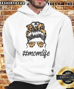 Stylish mom wearing leopard pattern shades and a cool messy bun in a cozy hoodie, embodying top-classy mom life.