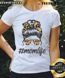 Chic mom wearing a leopard-pattern tee and shades, showcasing a cool messy bunperfect for top classy mom life.