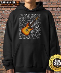 Alt Text: Guitarist in a hoodie playing electric guitar surrounded by musical notes, showcasing passion for music education.