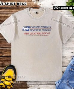 Top Fcking Rabbits Sexpress Service washed t-shirt displayed on a wooden background, showcasing a playful graphic design.