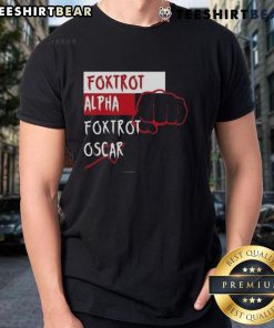 Top Foxtrot Alpha Foxtrot Oscar T-Shirt displayed on a wooden background, showcasing a trendy design for casual wear.