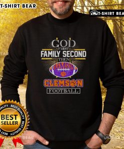 Alt Text: Cozy Clemson football sweatshirt featuring Top God, First Family, Second slogan for fans and supporters.