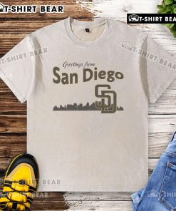 Alt Text: Top Greetings From San Diego Padres Skyline Washed T-Shirt featuring vibrant city skyline and Padres logo.