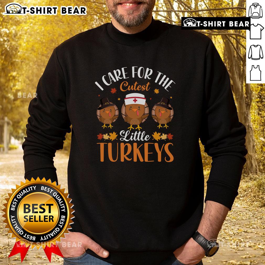 Top I Care For The Cutest Little Turkeys Thanksgiving Sweatshirt Alt Text: Cute Thanksgiving sweatshirt featuring adorable little turkeys, perfect for holiday celebrations and cozy gatherings.