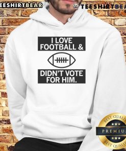 Top 'I Love Football And Didn't Vote For Him' hoodie featuring bold text design, perfect for football fans.