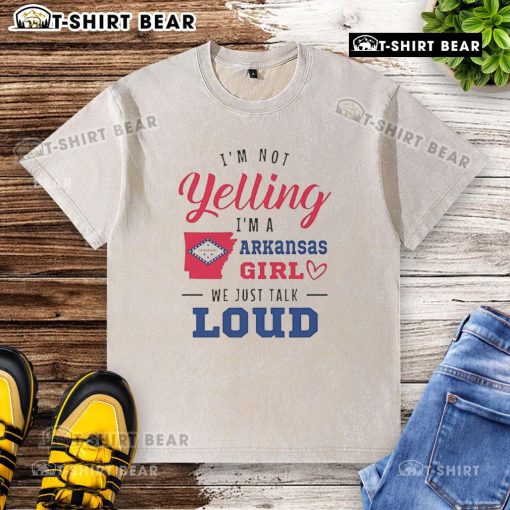 Top 'Im Not Yelling, Im an Arkansas Girl, We Just Talk Loud' washed t-shirt, perfect for showcasing Southern pride.