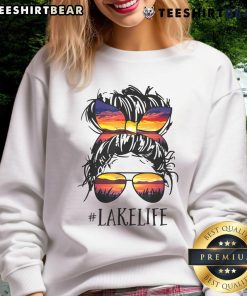 Women in sweatshirts enjoying top lake life with messy buns - perfect for moms, grandmas, and casual outings.