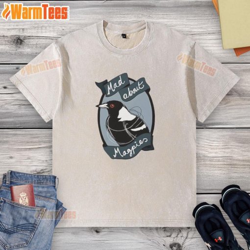 Alt Text: Top Mad About Magpies logo on a washed t-shirt, featuring a stylish design perfect for fans of the team.