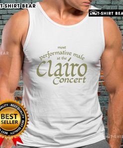 Top most performative male at the Clairo concert wearing a stylish tank top, engaging the audience with dynamic energy.