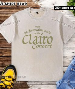 Top most performative male at the Clairo concert wearing a washed t-shirt, engaging the crowd with energy.