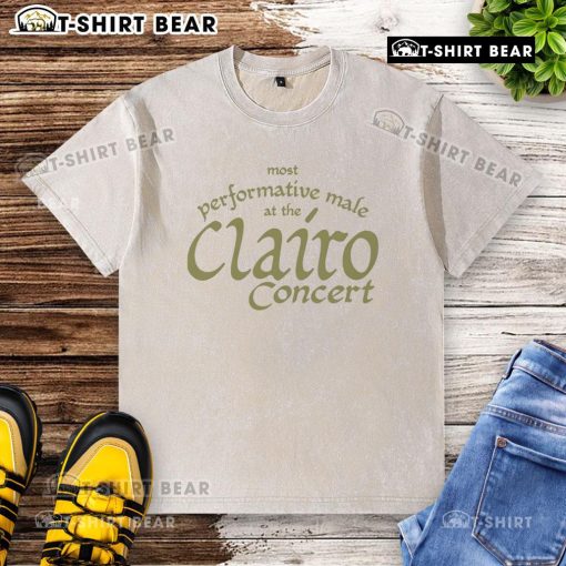Top most performative male at the Clairo concert wearing a washed t-shirt, engaging the crowd with energy.