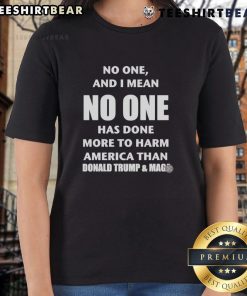 Graphic tee featuring the text 'No One Has Done More to Harm America Than Donald Trump' with MAGA theme.