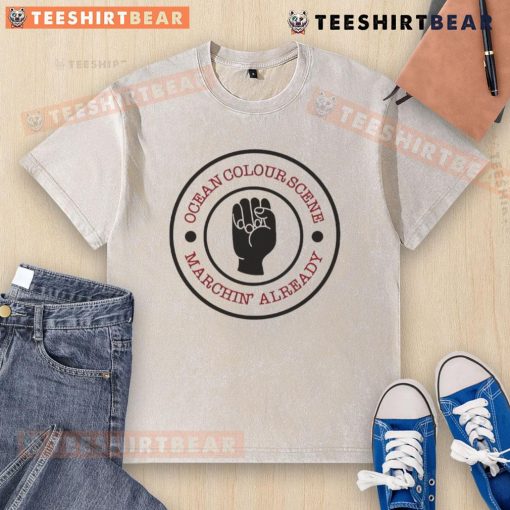 Alt Text: Top Ocean Colour Scene Machine Already Washed T-Shirt displayed on a wooden surface, showcasing vibrant colors and design.