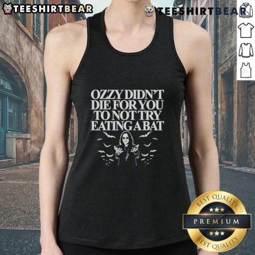 Person wearing 'Top Ozzy Didn't Die For You To Not Try Eating A Bat' tank top, showcasing rock music humor and style.